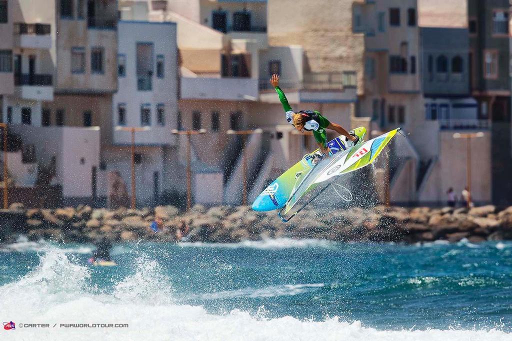 Trademark move for Alessio Stillrich - 2014 PWA Pozo World Cup / Gran Canaria Wind and Waves Festival ©  Carter/pwaworldtour.com http://www.pwaworldtour.com/